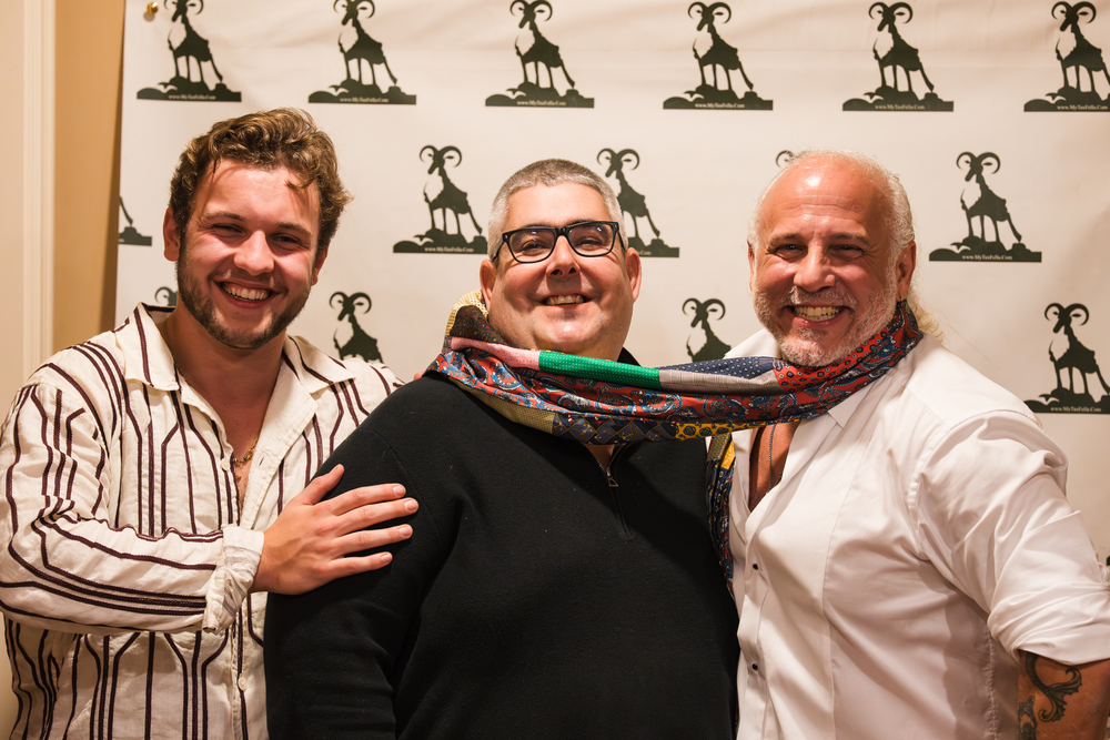 Guests with Anthony Mauriello at the My Tax Fella step-and-repeat